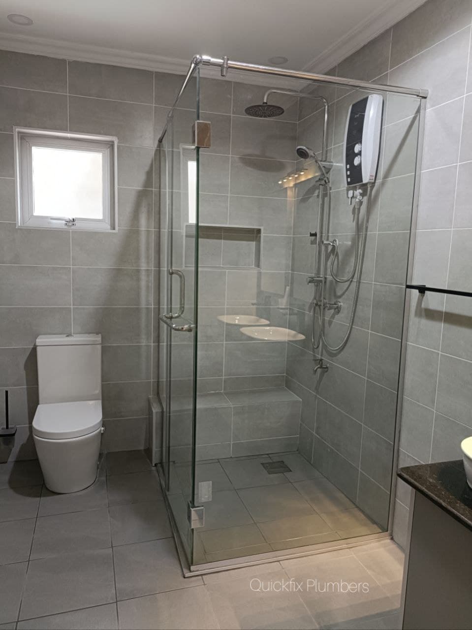 Frameless tempered glass shower enclosure